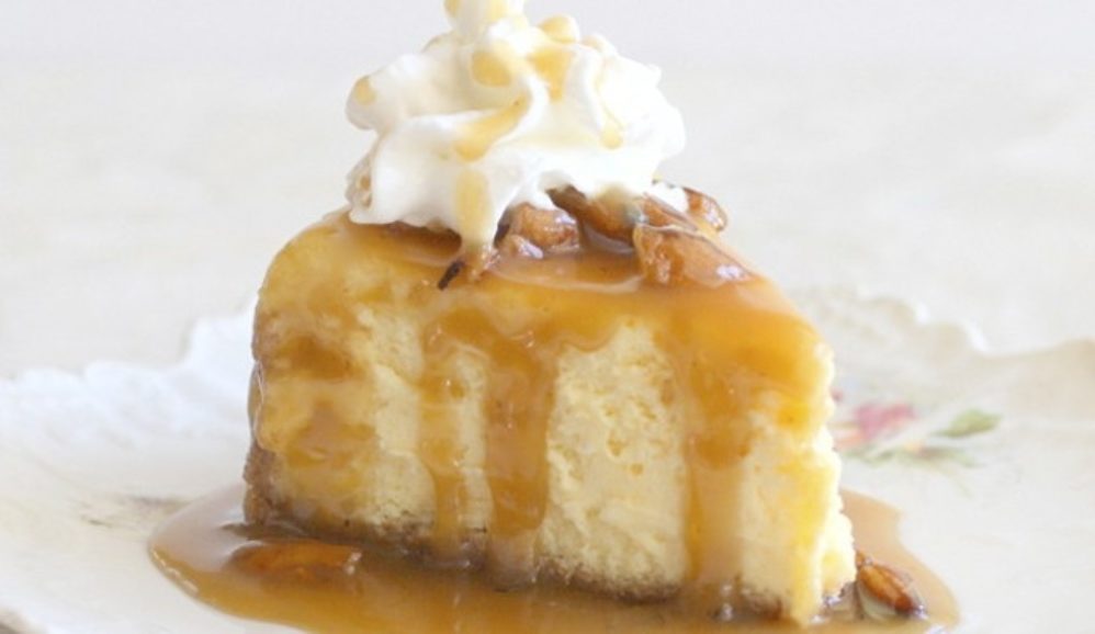 Photo of Eggnog Cheesecake with Honey Bourbon Praline Sauce